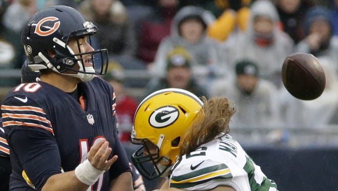 Chicago Bears quarterback Mitchell Trubisky (10) throws an incomplete pass while being pressured by Green Bay Packers outside linebacker Clay Matthews (52) during the third quarter of their game Sunday, November 12, 2017, at Soldier Field.
