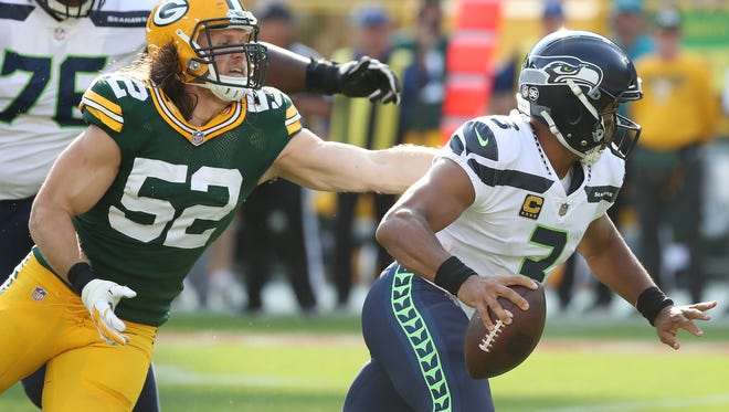 Green Bay Packers outside linebacker Clay Matthews (52) pursues quarterback Russell Wilson (3) against the Seattle Seahawks Sunday, September 10, 2017 at Lambeau Field in Green Bay, Wis.