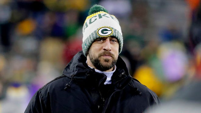 Green Bay Packers quarterback Aaron Rodgers watches from the sideline before the game against Minnesota.