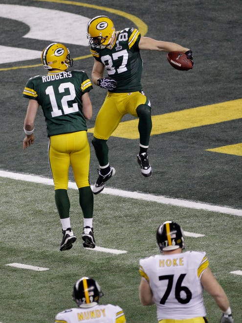 Packers quarterback Aaron Rodgers (12) and receiver Jordy Nelson celebrate Nelson's touchdown in the first quarter against the Pittsburgh Steelers in Super Bowl XLV.