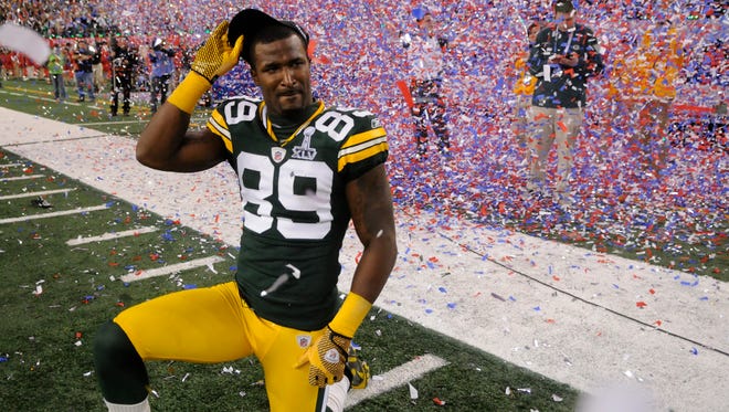 Green Bay Packers receiver James Jones is overwhelmed with emotion after the team's victory over the Pittsburgh Steelers in Super Bowl XLV at Cowboys Stadium in Arlington, Texas, on Sunday, Feb. 6, 2011.