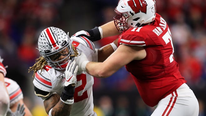 Wisconsin offensive lineman Cole Van Lanen battles Ohio State defensive end Chase Young during the 2019 Big Ten championship game in Indianapolis.