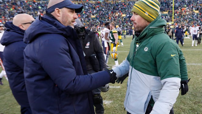 Chicago Bears head coach Matt Nagy shakes hands with Green Bay Packers head coach Matt LaFleur after an NFL football game Sunday, Dec. 15, 2019, in Green Bay, Wis. The Packers won 21-13. (AP Photo/Mike Roemer)