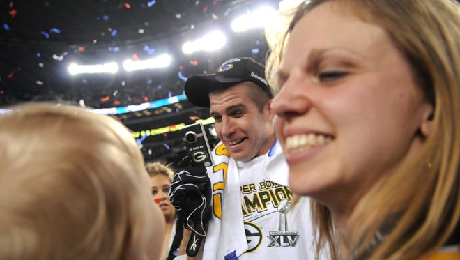 Green Bay Packers receiver Jordy Nelson, center, videos his wife Emily, right, and son after the Packers defeated the Pittsburgh Steelers in Super Bowl XLV at Cowboys Stadium in Arlington, Texas on Feb. 6, 2011.  Photo by Corey Wilson/Press-Gazette