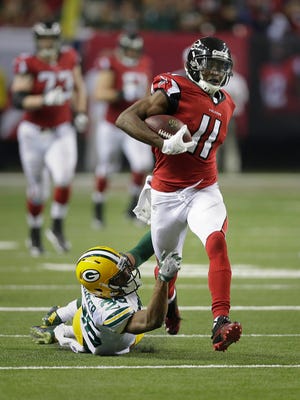 Packers cornerback LaDarius Gunter can't stop Falcons wide receiver Julio Jones from scoring a touchdown in the second half Sunday in the  NFC Championship Game.