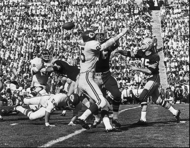 Green Bay Packers quarterback Bart Starr (right) throws a pass during first quarter action during Super Bowl I against the Kansas City Chiefs, at the Los Angeles Coliseum. The Packers beat the Chiefs 35-10.
