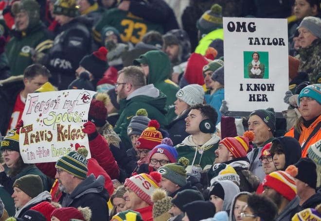Fans hold up signs referencing pop star Taylor Swift and Kansas City Chiefs tight end Travis Kelce during a game between the Green Bay Packers and the Chiefs on Sunday, December 3, 2023, at Lambeau Field in Green Bay, Wis. 
Tork Mason/USA TODAY NETWORK-Wisconsin
