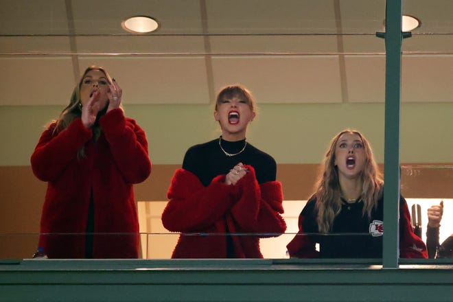 Lyndsay Bell, from left, Taylor Swift and Brittany Mahomes react in a suite during the game between the Kansas City Chiefs and the Green Bay Packers at Lambeau Field Sunday in Green Bay.