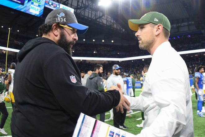 Detroit Lions head coach Matt Patricia (left) and Green Bay Packers head coach Matt LaFleur (right) shake hands after their game at Ford Field.