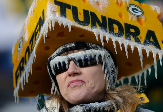 A fan embraces the cold before the start of the Packers-Titans game on Dec. 23, 2012, at Lambeau Field in Green Bay.