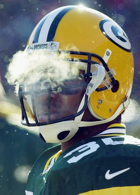 Green Bay Packers running back Ahman Green stands on the sidelines in the first quarter against the Tampa Bay Buccaneers at Lambeau Field Sunday, Dec. 24, 2000, in Green Bay, Wis. The wind chill factor was nearly -20 degrees at game time.
