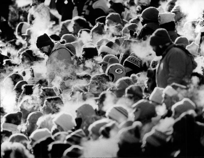 The Crowd geared-up for frigid temperatures during this Green Bay Packers game against the Detroit Lions at Lambeau Field December 22, 1991.