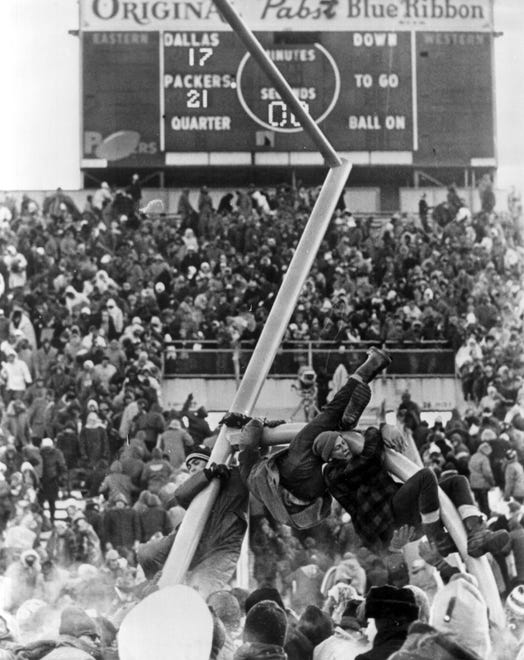 Fans tear down the goal posts after the Packers beat the Dallas Cowboys in the Ice Bowl in 1967 at Lambeau Field in Green Bay.