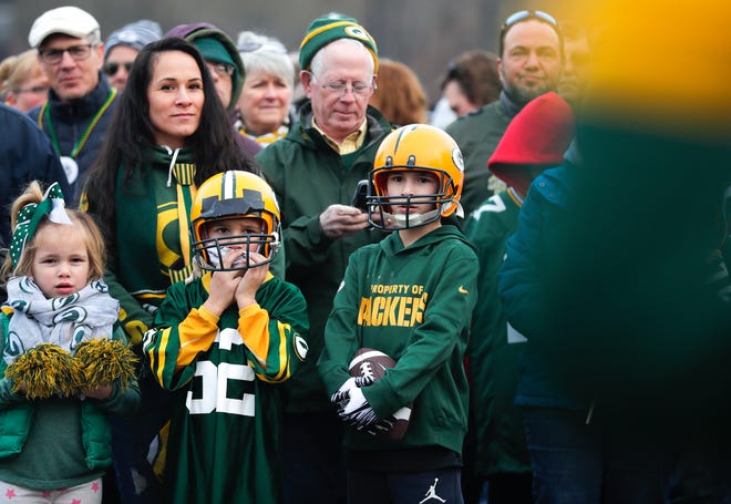 Kailixx, 5, left, Ryatt,6, middle, and Avynn McGregor, 10,  watch as the cheerleaders perform at the pep rally on Friday, January 10, 2020, at Packers Heritage Trail in Green Bay, Wis. The Packers made it to the NFC Championship game against the San Francisco 49ers. The 49ers defeated the Packers 37-20.