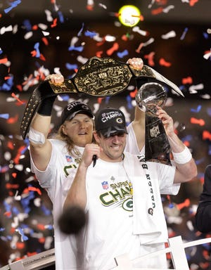 Aaron Rodgers, right, and Clay Matthews celebrate the Packers' victory and Rodgers' MVP award after they beat the Steelers in Super Bowl XLV.