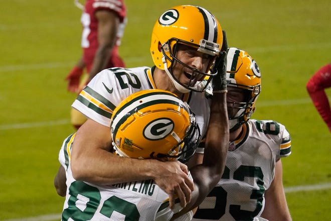 Green Bay Packers wide receiver Marquez Valdes-Scantling, bottom left, and quarterback Aaron Rodgers (12) celebrate after connecting on a touchdown pass during the second half of an NFL football game against the San Francisco 49ers in Santa Clara, Calif., Thursday, Nov. 5, 2020.