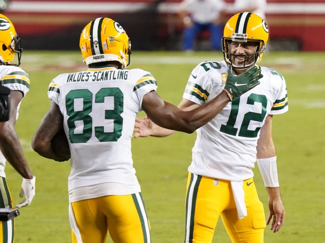Green Bay Packers wide receiver Marquez Valdes-Scantling (83) celebrates with quarterback Aaron Rodgers (12) after catching a pass to score a touchdown against the San Francisco 49ers during the second quarter at Levi's Stadium.