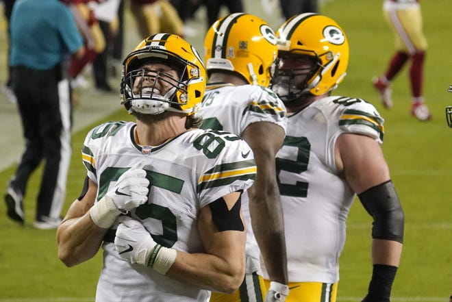 Green Bay Packers tight end Robert Tonyan (85) celebrates after tight end Marcedes Lewis, middle, scored a touchdown against the San Francisco 49ers during the first half of an NFL football game in Santa Clara, Calif., Thursday, Nov. 5, 2020.