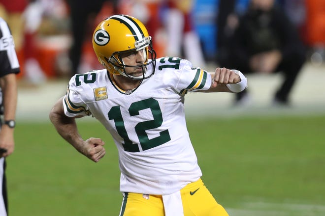 Green Bay Packers quarterback Aaron Rodgers (12) celebrates after throwing a touchdown pass against the San Francisco 49ers during the first half of an NFL football game in Santa Clara, Calif., Thursday, Nov. 5, 2020.