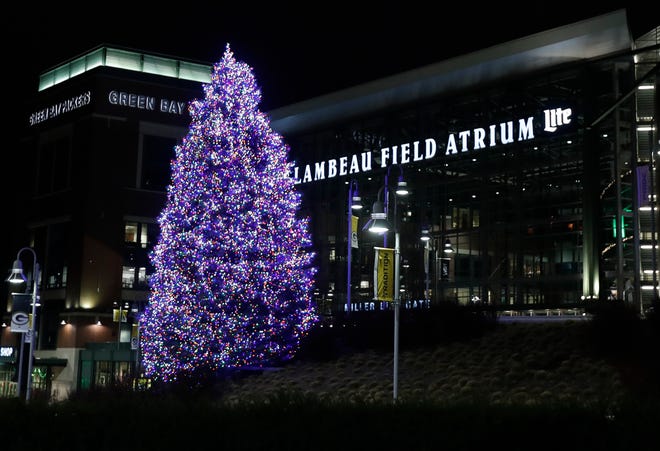 A 46-foot evergreen tree was decorated with more than 10,000 lights in front of the Lambeau Field Atrium to celebrate the 2020 holiday season.