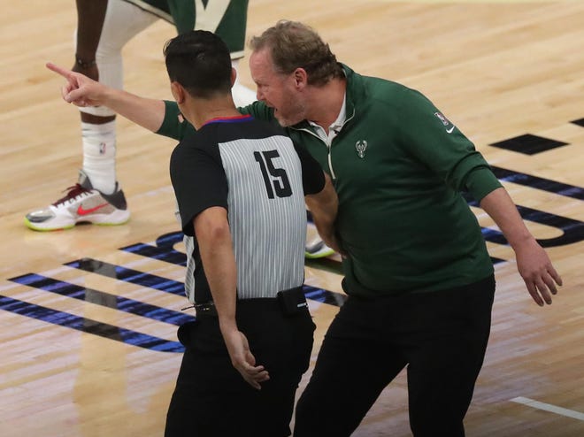 Milwaukee Bucks head coach Mike Budenholzer talks wo an official during the first half of their Eastern Conference finals game against the Atlanta Hawks Wednesday, June 23, 2021 at Fiserv Forum in Milwaukee, Wis.



MARK HOFFMAN/MILWAUKEE JOURNAL SENTINEL