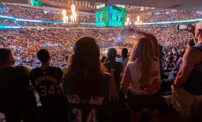 Milwaukee Bucks fans cheer their team during introductions  before their Eastern Conference finals game against the Atlanta Hawks Wednesday, June 23, 2021 at Fiserv Forum in Milwaukee, Wis.



MARK HOFFMAN/MILWAUKEE JOURNAL SENTINEL