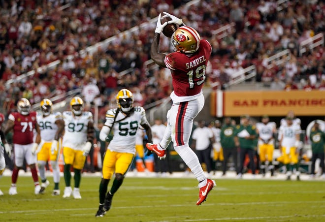 Deebo Samuel (19) of the San Francisco 49ers catches a pass during the third quarter against the Green Bay Packers in the game at Levi's Stadium on September 26, 2021 in Santa Clara, California.