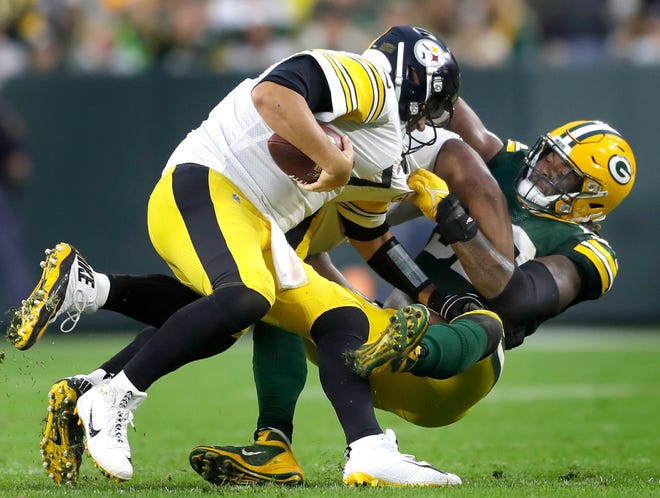 Green Bay Packers linebacker Rashan Gary sacks Pittsburgh Steelers quarterback Ben Roethlisberger in the second half on Sunday, Oct. 3, 2021, at Lambeau Field.