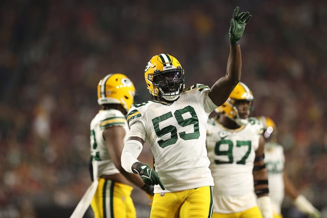 GLENDALE, ARIZONA - OCTOBER 28: De'Vondre Campbell #59 of the Green Bay Packers reacts after sacking Kyler Murray #1 of the Arizona Cardinals during the first half at State Farm Stadium on October 28, 2021 in Glendale, Arizona. (Photo by Christian Petersen/Getty Images)