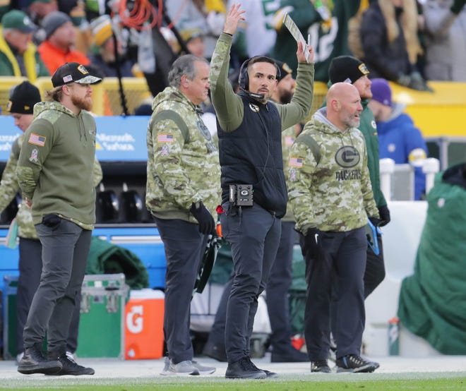 Green Bay Packers head coach Matt LaFleur revs the crowd up during the first half of their game against the Seattle Seahawks on Sunday at Lambeau Field.