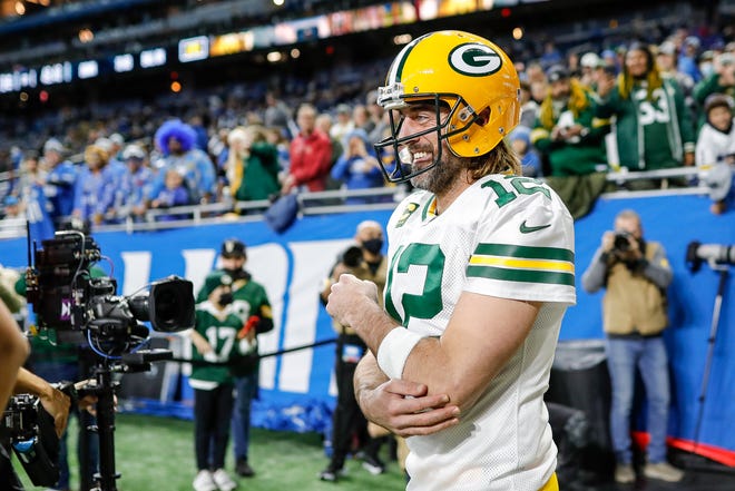 Packers quarterback Aaron Rodgers takes the field for warm up before the game against the Lions on Sunday, Jan. 9, 2022, at Ford Field.