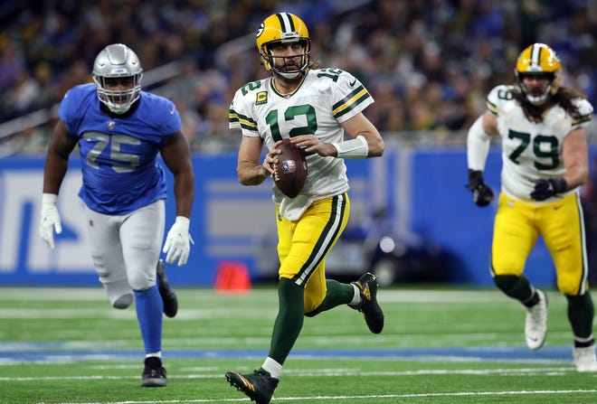 DETROIT, MICHIGAN - JANUARY 09: Aaron Rodgers of the Green Bay Packers looks to pass during the first quarter against the Detroit Lions at Ford Field on January 09, 2022 in Detroit, Michigan.