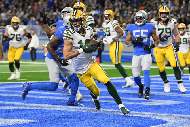 Green Bay Packers wide receiver Allen Lazard catches a pass for a touchdown during the first half of an NFL football game against the Detroit Lions, Sunday, Jan. 9, 2022, in Detroit. (AP Photo/Lon Horwedel)