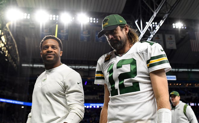 DETROIT, MICHIGAN - JANUARY 09: Randall Cobb #18 and Aaron Rodgers #12 of the Green Bay Packers walk off the field after a loss to the Detroit Lions at Ford Field on January 09, 2022 in Detroit, Michigan. (Photo by Nic Antaya/Getty Images)