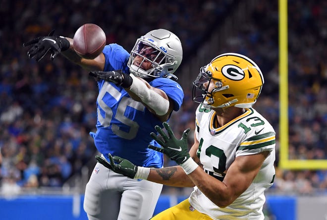 DETROIT, MICHIGAN - JANUARY 09: Allen Lazard #13 of the Green Bay Packers catches a touchdown pass during the second quarter against the Detroit Lions at Ford Field on January 09, 2022 in Detroit, Michigan.