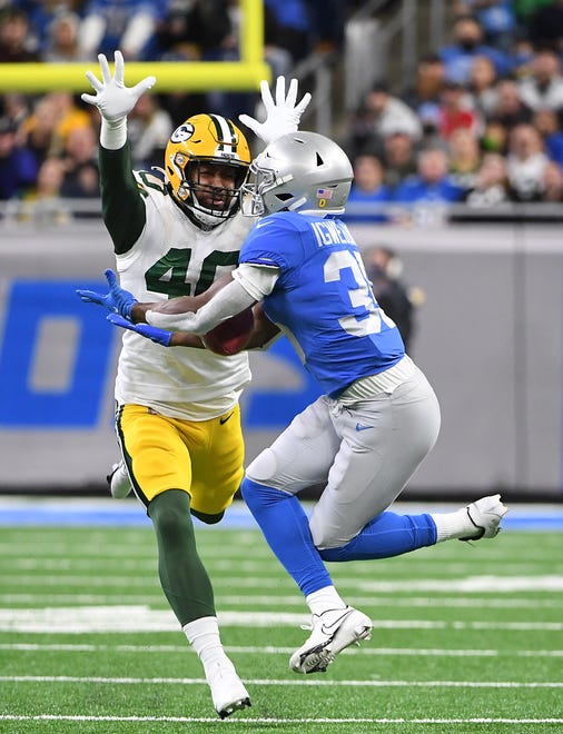 DETROIT, MICHIGAN - JANUARY 09: Godwin Igwebuike #35 of the Detroit Lions drops a pass during the first quarter against the Green Bay Packers at Ford Field on January 09, 2022 in Detroit, Michigan.