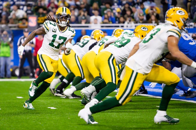 Jan 9, 2022; Detroit, Michigan, USA; Green Bay Packers wide receiver Davante Adams (17) goes in motion before the snap during the first quarter against the Detroit Lions at Ford Field.