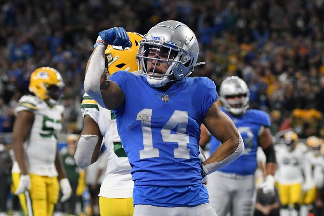 Detroit Lions wide receiver Amon-Ra St. Brown reacts after a 2-yard reception for a touchdown during the first half of an NFL football game against the Green Bay Packers, Sunday, Jan. 9, 2022, in Detroit. (AP Photo/Lon Horwedel) ORG XMIT: DTF112