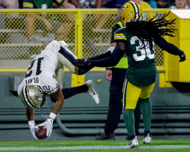 New Orleans Saints wide receiver Chris Olave (12) somersaults into the endzone for a touchdown against the Green Bay Packers during their football game on Friday, August 19, 2022, at Lambeau Field in Green Bay, Wis. The Packers won the game, 20-10.
Tork Mason/USA TODAY NETWORK-Wisconsin