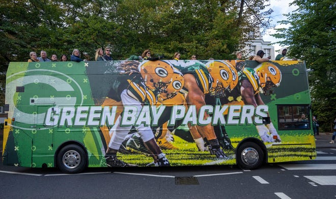 A double decker bus carrying Green Bay Packers fans crosses the Abbey Road crosswalk made famous by the Beatles Friday, October 7, 2022 in London. The Packers will play their first game ever in the United Kingdom on Sunday against the New York Giants.
