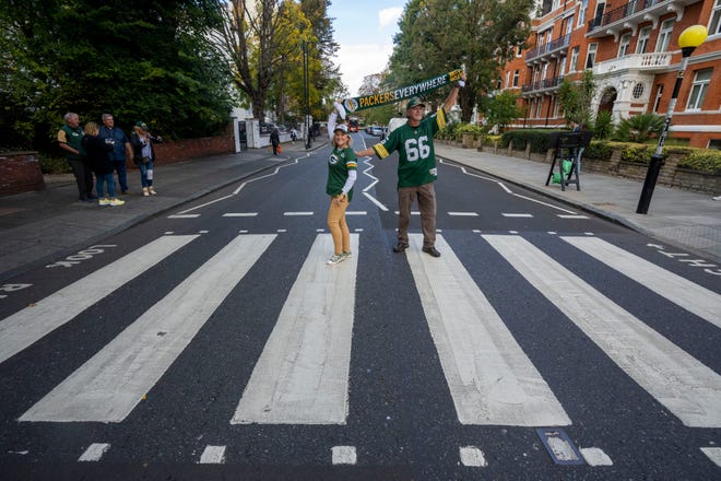 Denise and Don Larenz pose for photo while transiting the Abbey Road crosswalk made famous by the Beatles Friday, October 7, 2022 in London. The Packers will play their first game ever in the United Kingdom on Sunday against the New York Giants. The couple, from Waukesha, will be attending the game.