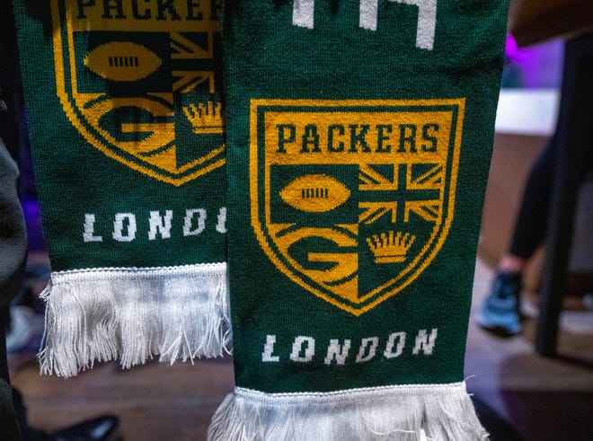 Commemorative Green Bay Packers scarves are sold  during a rally for the Green Bay Packers Thursday, October 6, 2022 in London. The Packers will play their first game ever in the United Kingdom on Sunday against the New York Giants.