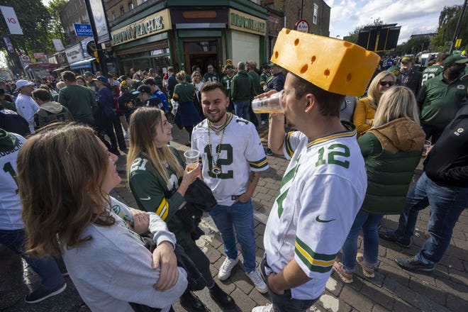 Fans socialize and party before the Green Bay Packers game against the New York Giants Sunday, October 9, 2022 outside Tottenham Hotspur Stadium in London. The Green Bay Packers will play their first game ever in the United Kingdom on Sunday against the New York Giants.