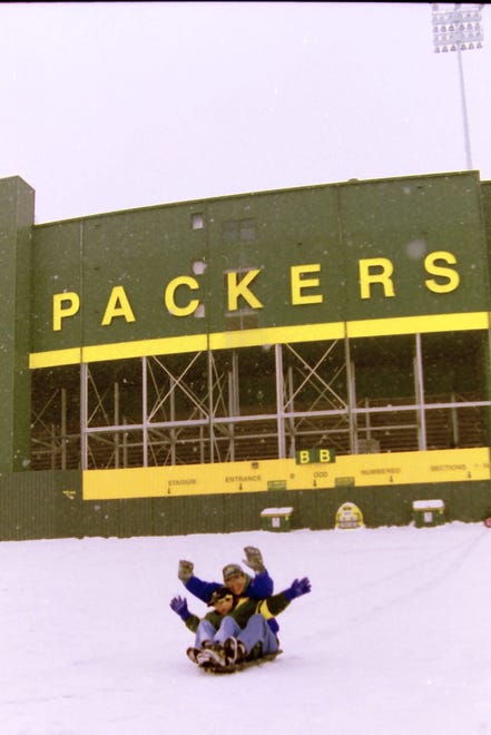 Two people go sledding at Lambeau Field in January of 1998 in in Green Bay, Wis.