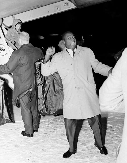 Green Bay Packers safety Willie Wood reacts to an estimated 15,000 fans who greeted the football team when it returned to Green Bay on Jan. 2, 1967, at Austin Straubel Airport in Ashwaubenon, Wis. The Packers defeated the Dallas Cowboys 34-27 for the NFL championship in Dallas.
