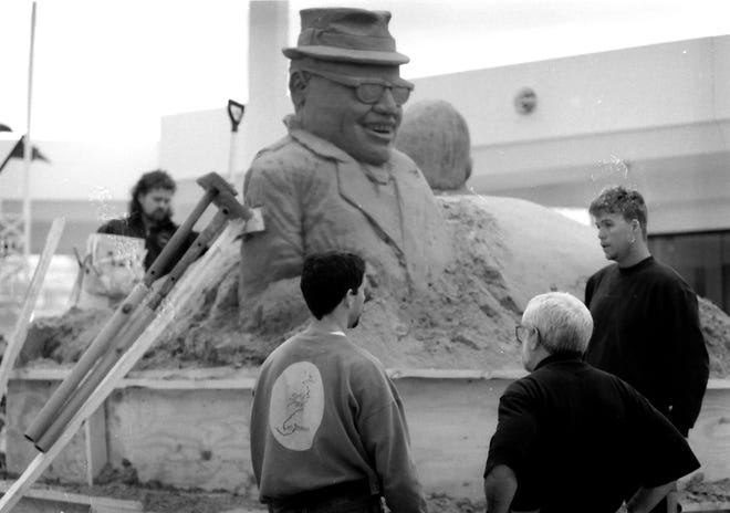 A sand sculpture of Vince Lombardi outside Bay Park Square, Ashwaubenon, didn't hold together because the sand was frozen. From left, artists Tom Bailas, Jim Richardson and Mark Mason on Jan 23, 1997.