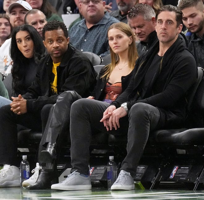 Green Bay Packers quarterback Aaron Rodgers, right, and Mallory Edens, center, and Packers wide receiver Randall Cobb during the second half of the Milwaukee Bucks-Los Angeles Lakers game Friday, December 2, 2022 at Fiserv Forum in Milwaukee, Wis. The Lakes beat the Bucks 133-129.