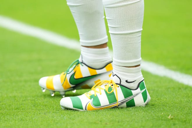 A detail view of the cleats worn by Christian Watson of the Green Bay Packers before the game against the Miami Dolphins at Hard Rock Stadium on Dec. 25, 2022, in Miami Gardens, Florida.