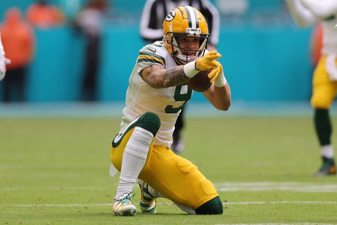 Christian Watson of the Green Bay Packers celebrates after a reception in the second quarter of the game against the Miami Dolphins on Dec. 25, 2022, at Hard Rock Stadium in Miami Gardens, Florida.
