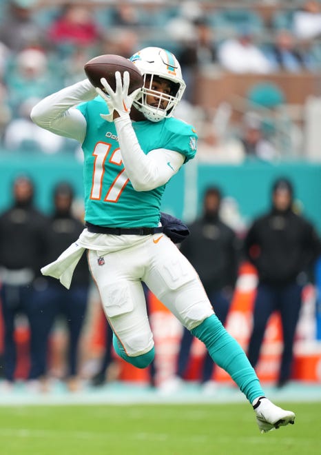 Miami Dolphins wide receiver Jaylen Waddle (17) makes a catch before running for an 84-yard touchdown against the Green Bay Packers on the first play of the team's second drive on Dec. 25, 2022, at Hard Rock Stadium.